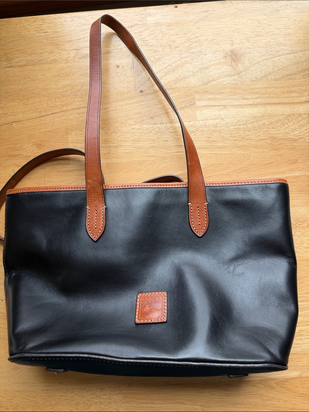 Dooney & Bourke Black Leather Tote with Brown Trim and Straps